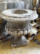 A reconstituted stone campana garden urn, diameter 36cm, height 38cm