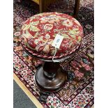 An early Victorian mahogany revolving piano stool