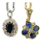 A modern 9ct gold, sapphire and diamond set pendant, overall 19mm, on a 375 chain, 38cm and a
