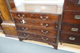 A George III and later mahogany dressing chest, the compartmented top drawer with sliding baize