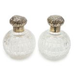 A pair of late Victorian silver mounted cut glass globular scent bottles (a.f.), Haseler Brothers,