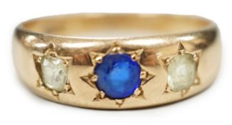A late Victorian 15ct gold and gypsy set three stone gem set ring, size Q/R, gross weight 4.3