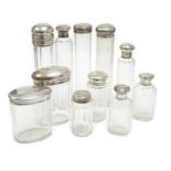 Forty four assorted silver or white metal mounted glass toilet bottles, tallest 18cm, a quantity