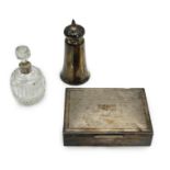 A 1970's engine turned silver mounted rectangular cigarette box, a silver mounted glass sugar caster