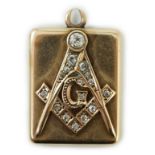 An Edwardian yellow metal and diamond cluster set masonic locket pendant, with engraved