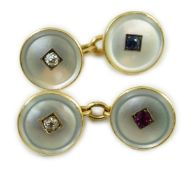A pair of early to mid 20th century yellow metal mounted mother of pearl and gem set cufflinks,