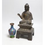 A Chinese or Japanese cast iron seated figure of Buddha and a cloisonne enamel ‘dragon’ vase,