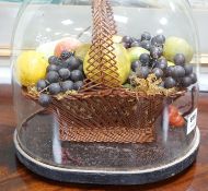 A Victorian wax fruit arrangement in a basket under glass dome, 34cms high