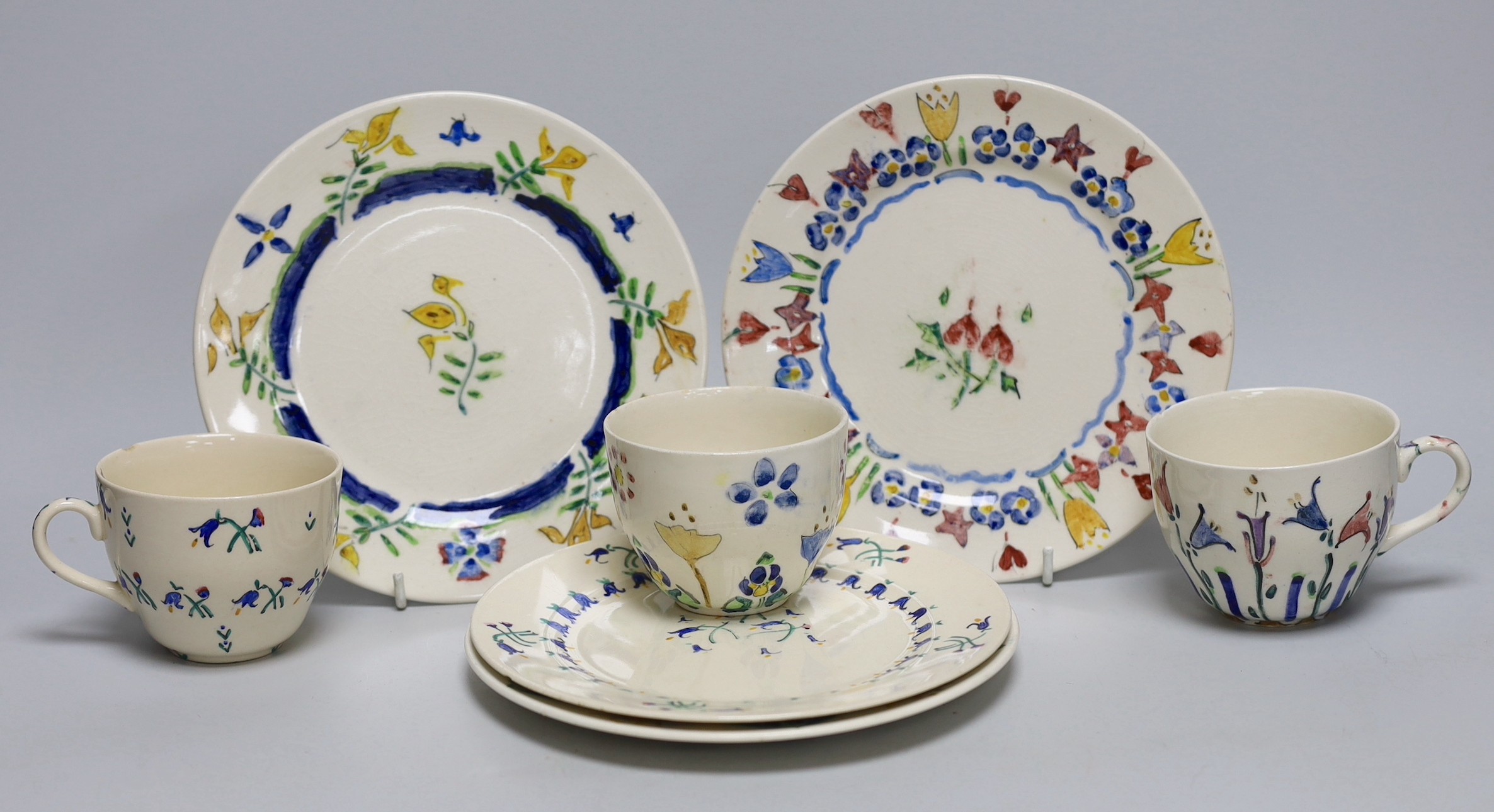 Jessie Marion King (1875-1949), four various floral design tea plates and three tea cups