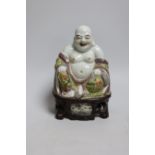A Chinese enamelled porcelain figure of Budai, 20cm high
