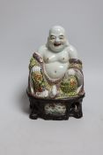 A Chinese enamelled porcelain figure of Budai, 20cm high