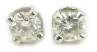 A pair of 9ct white metal and solitaire diamond ear studs, stone diameter approx. 3.4mm, gross