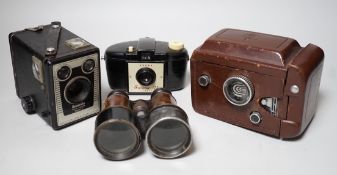 A quantity of camera equipment and a pair of military binoculars