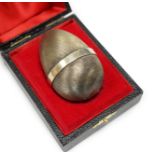 An Elizabeth II Stuart Devlin silver gilt surprise egg, opening to reveal a hedgehog, no. 152,