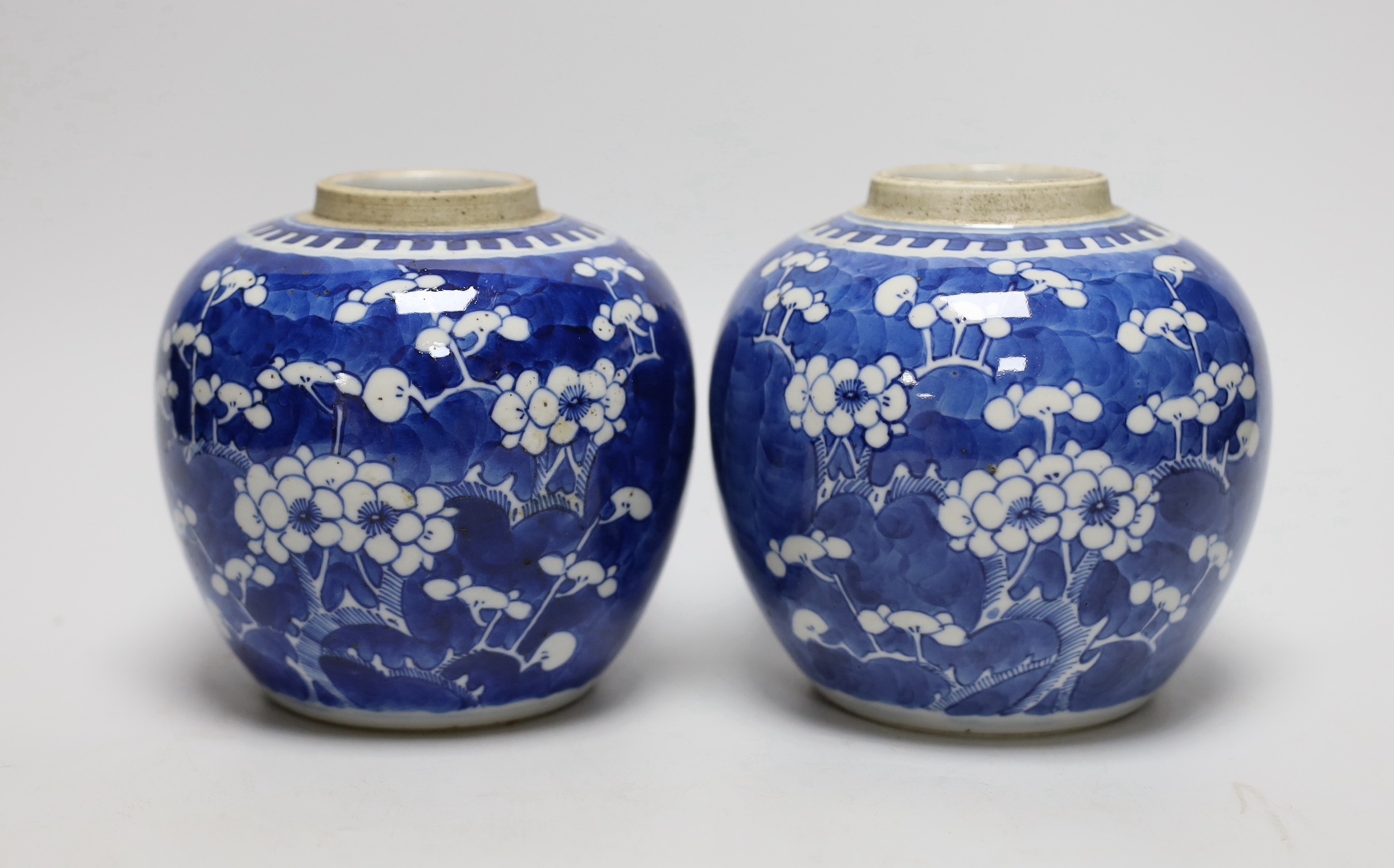A pair of 19th centiury Chinese blue and white prunus jars, 13.5cms high