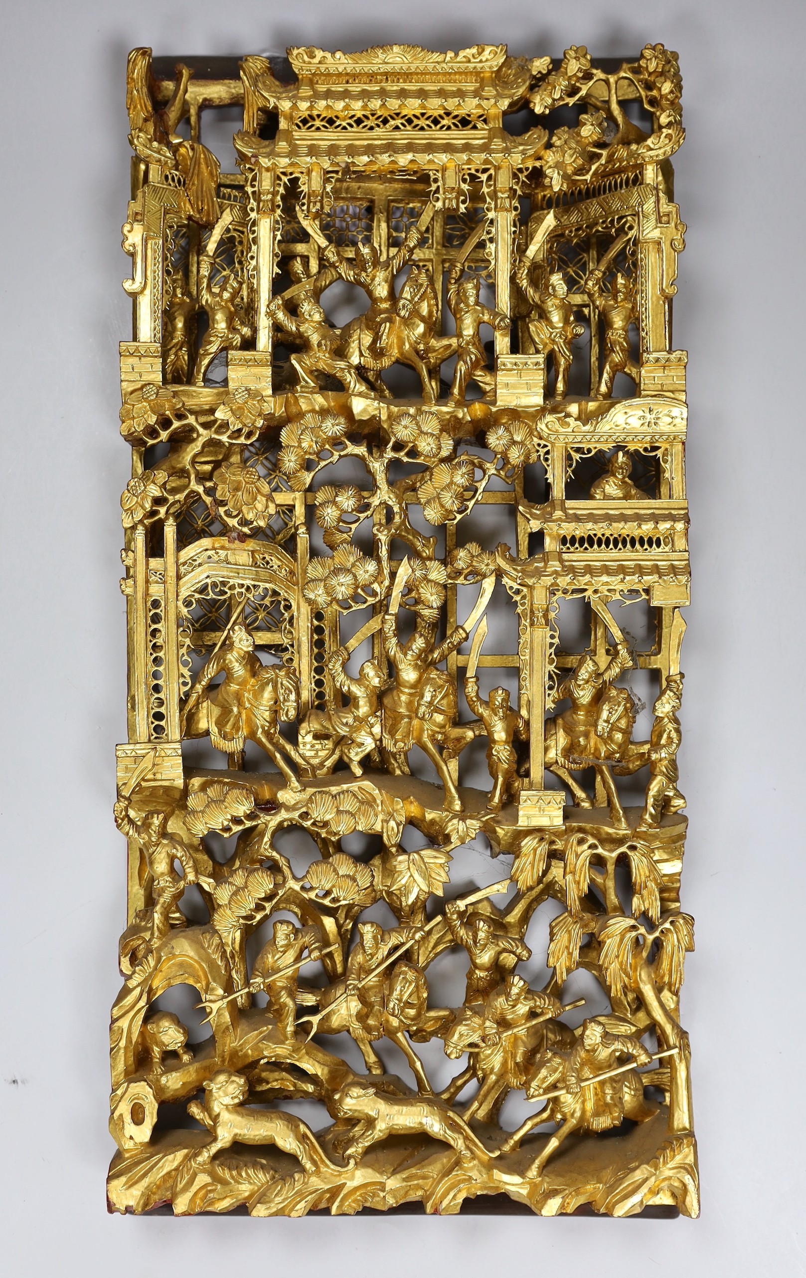 A Chinese gilt carved figural relief, 25cms wide, 54cms high