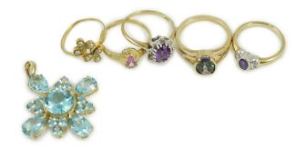 Four assorted modern 9ct gold and gem set rings, a white metal and seed pearl ring and a 9ct gold