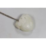 A Chinese white jade "bat and peach" pendant