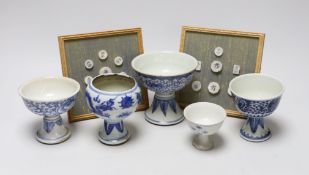 Five 19th century Chinese blue and white stem cups and two framed sets of Thai gaming counters,