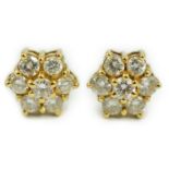 A pair of yellow metal and seven stone diamond cluster set ear studs, 7mm, gross weight 2.8 grams.