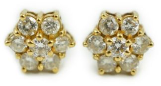 A pair of yellow metal and seven stone diamond cluster set ear studs, 7mm, gross weight 2.8 grams.