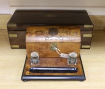 A Victorian brass bound rosewood writing slope and a Victorian walnut inkstand stationery rack,