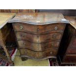 A small George III style mahogany serpentine chest of four drawers, width 65cm, depth 43cm, height