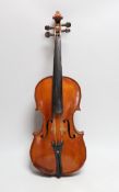 A cased 19th century French violin, back 34cm