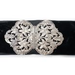 A late Victorian pierced silver belt buckle, on a black sash belt, James Deakin & Sons, Chester,