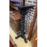 A Chinese ebonised hardwood pedestal stand, width 42cm, height 136cm