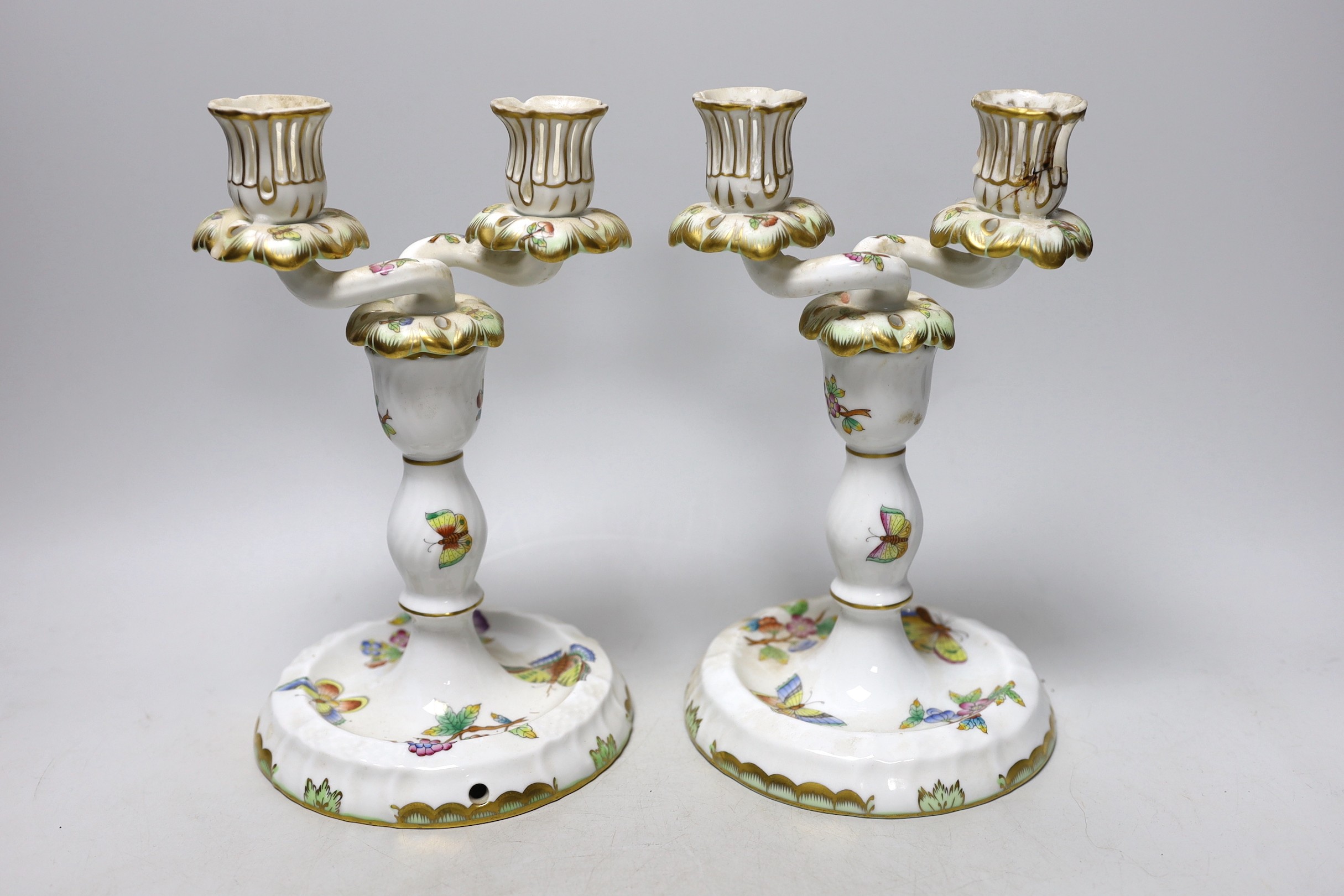 A pair of Herend porcelain two branch candelabra, 22cm