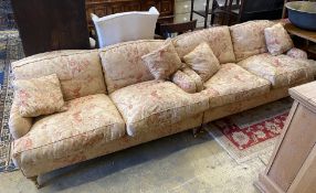 A pair of John Sankey two seater settees with feather cushion seats and backs, length 156cm, depth