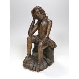 A 17th/18th century Italian limewood figural carving of Jesus perched, 31cm