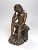 A 17th/18th century Italian limewood figural carving of Jesus perched, 31cm