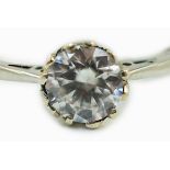 An 18ct and plat set and simulated diamond ring, the stone diameter approx. 4.5mm, size J, gross