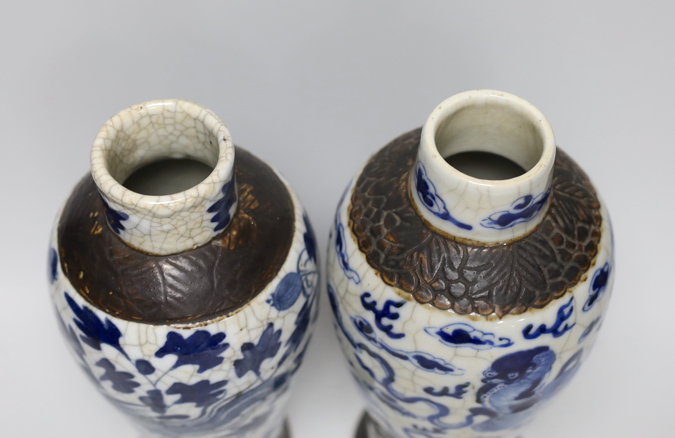 A pair of 19th century Chinese crackleglaze blue and white vases, 27cm - Image 3 of 4