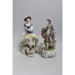 Two 18th century Derby figures: a seated lady and gentleman with a dog, 23cms high