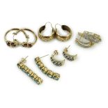 Four assorted modern pairs of 9ct gold and gem set earrings and one pair of yellow metal earrings,