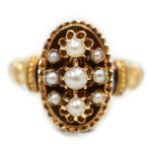 An early 20trh century French yellow metal (18ct poincon mark) and seed pearl cluster set oval ring,