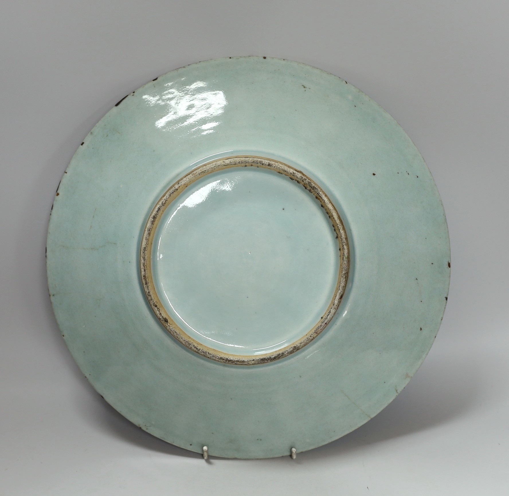 A 19th century Chinese famille rose enamelled carved celadon glazed dish, 34cm - Image 2 of 3