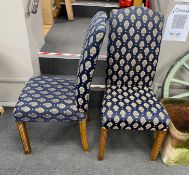 A set of eight reproduction upholstered dining chairs