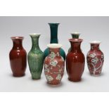A pair of Chinese sang de boeuf vases, another pair of Chinese mottled green bottles vases, two pink