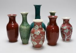 A pair of Chinese sang de boeuf vases, another pair of Chinese mottled green bottles vases, two pink