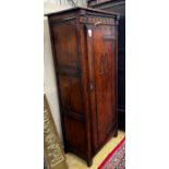 A 17th century style carved oak hall cupboard, width 76cm, depth 46cm, height 167cm