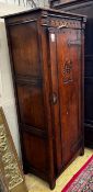 A 17th century style carved oak hall cupboard, width 76cm, depth 46cm, height 167cm