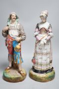 A pair of large Paris porcelain figures of a gentleman and a lady, lady 41cms high