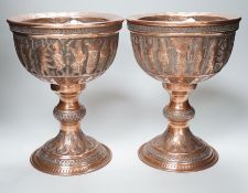 A pair of Persian copper figural decorated chalices, 27cms high