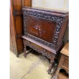 A 17th century style oak cocktail cabinet on stand, width 90cm, depth 50cm, height 137cm