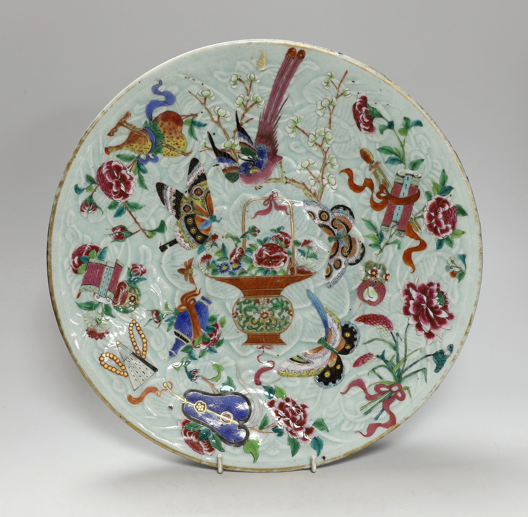 A 19th century Chinese famille rose enamelled carved celadon glazed dish, 34cm