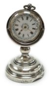 A George V silver mounted fob watch stand, Birmingham, 1923, 79mm, containing a Swiss white metal